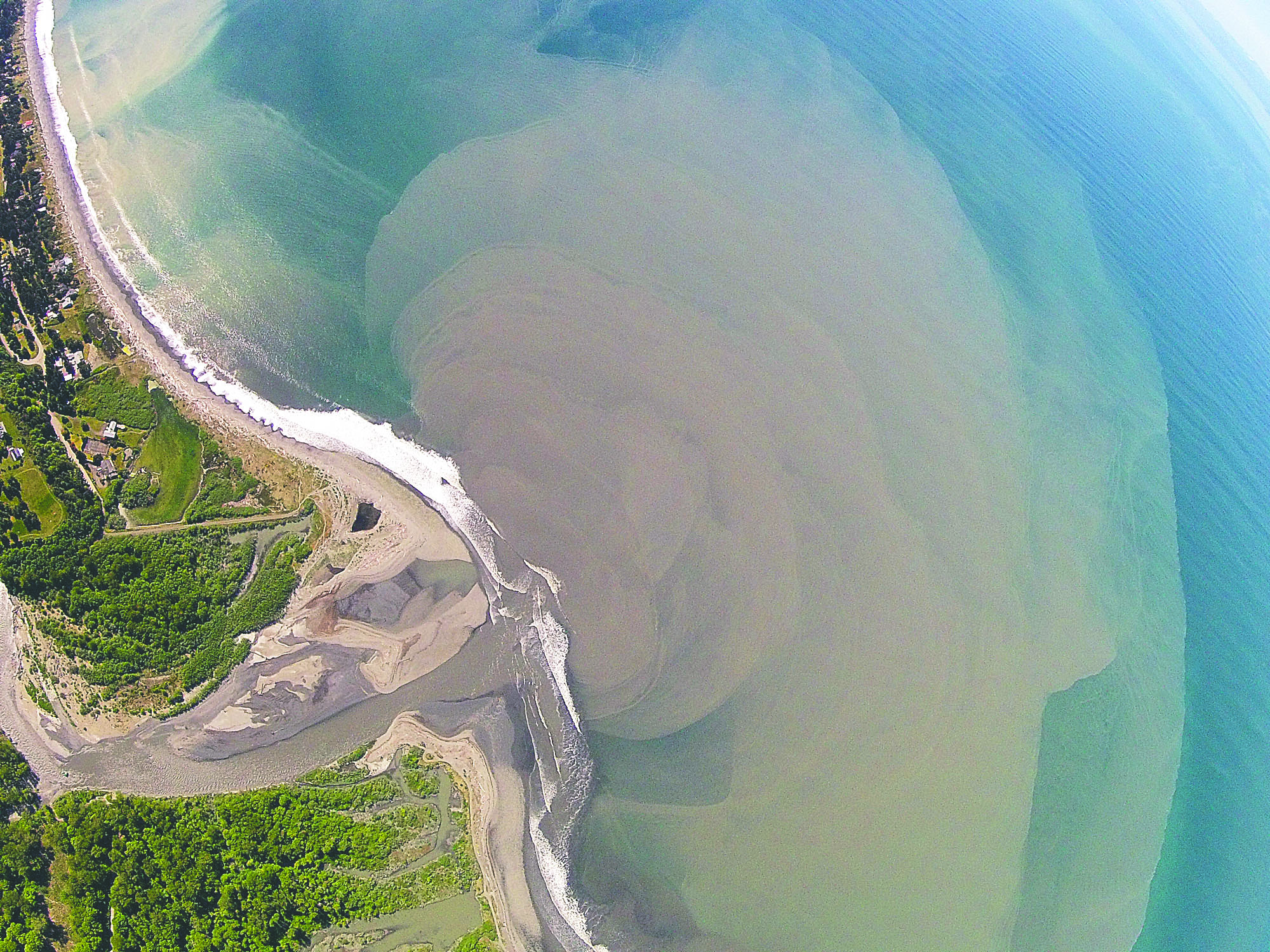 A plume of sediment can be seen widening out from the mouth of the Elwha River on Sunday. Tom Roorda