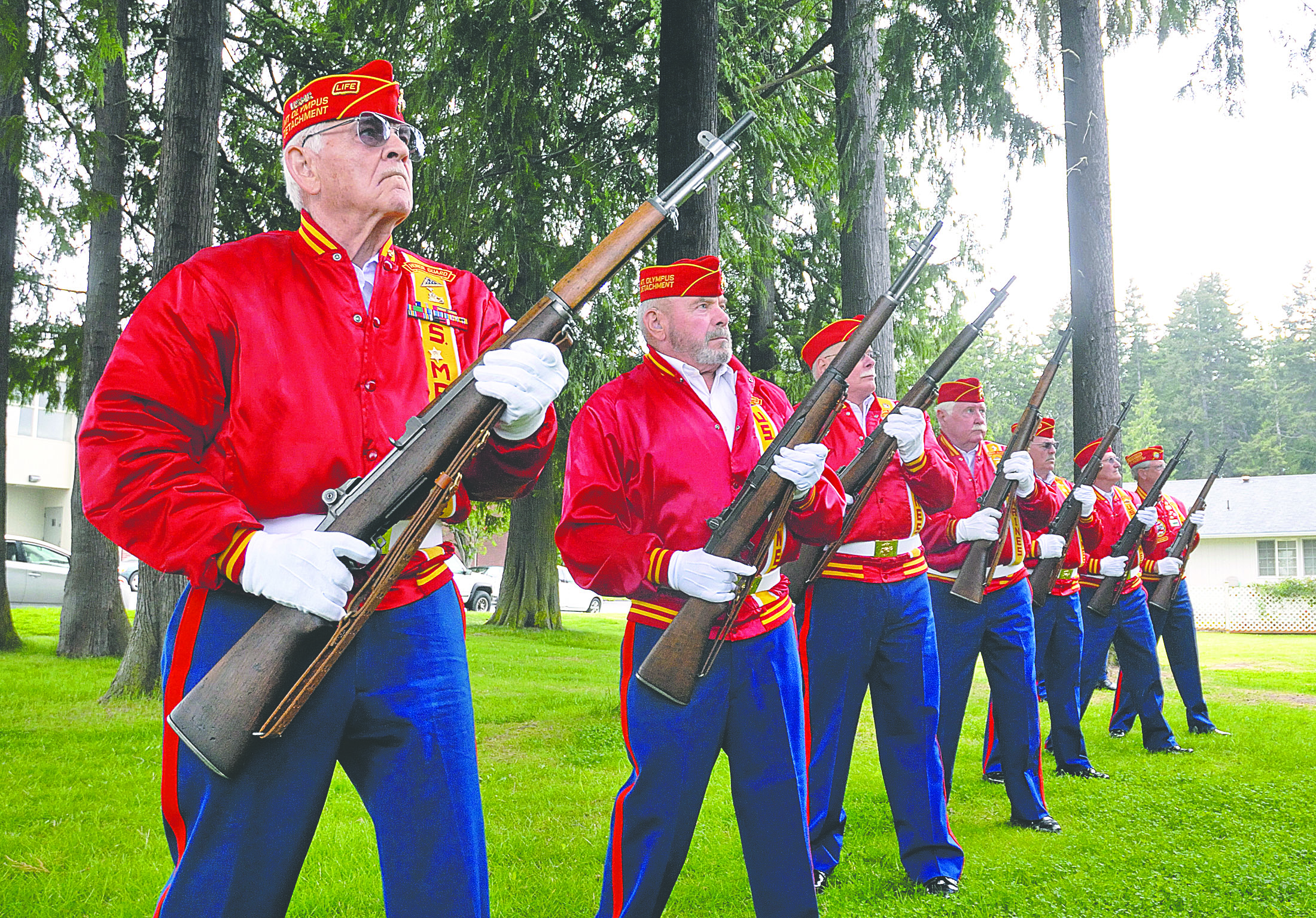 Members of the Marine Corps League Honor Guard Mount Olympus Detachment 897 perform a rifle salute during a Memorial Day service at the Clallam County Veterans' Center in Port Angeles on Monday. From left is Don Alward