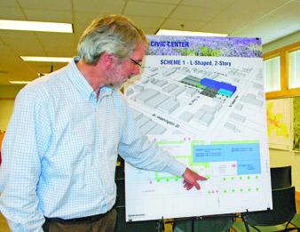 Sequim City Engineer David Garlington points out the features of one of three buildings schemes proposed for a Sequim Civic Center on West Cedar Street. Jeff Chew/Peninsula Daiy News