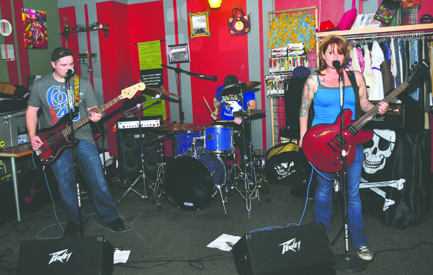 Trinity Avenue performs Friday at the last show to be held at the Caffeinated Clothier in Port Angeles. Jesse Major/for Peninsula Daily News