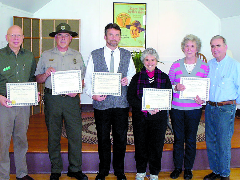 Jefferson County Historical Society winners of historic preservation awards holding certificates at a Fort Flagler ceremony June 16 are