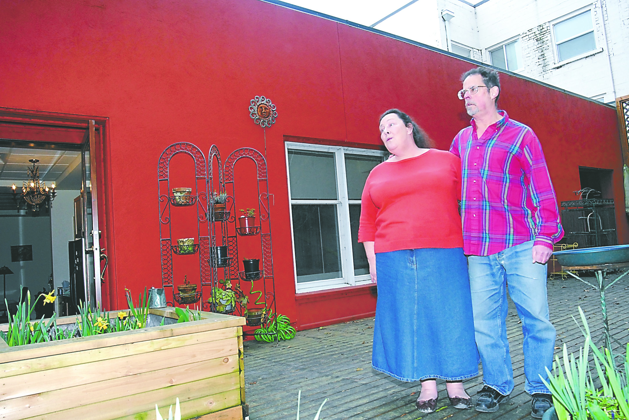 Catherine and Tom Harper stand on the rooftop patio area of their home on the upper floor of the Pioneer Building in downtown Port Angeles during last year's Second Story Story tour. Their home also is featured on this weekend's tour. Keith Thorpe/Peninsula Daily News