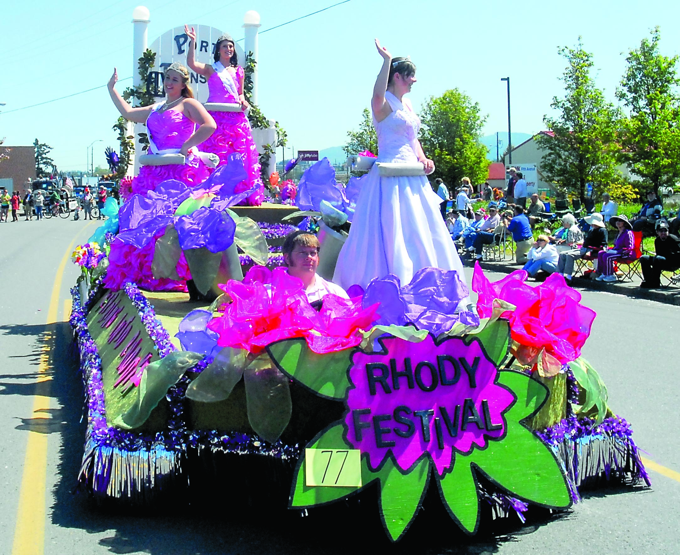 The Rhododendron Festival float makes its way down Washington Street during last weekend's Sequim Irrigation Festival parade. Royalty on the float are