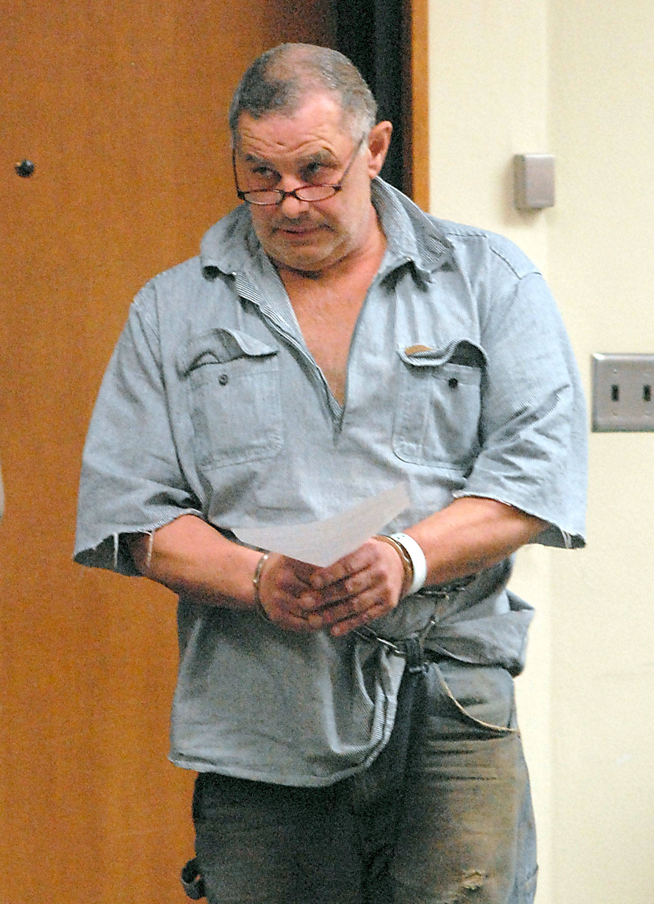 Roger Garman of Sequim enters Clallam County Superior Court in Port Angeles in connection with alleged threats made to a Jamestown S’Klallam school bus driver and the tribal office. (Keith Thorpe/Peninsula Daily News)                                Roger Garman of Sequim enters Clallam County Superior Court in Port Angeles. (Keith Thorpe/Peninsula Daily News)