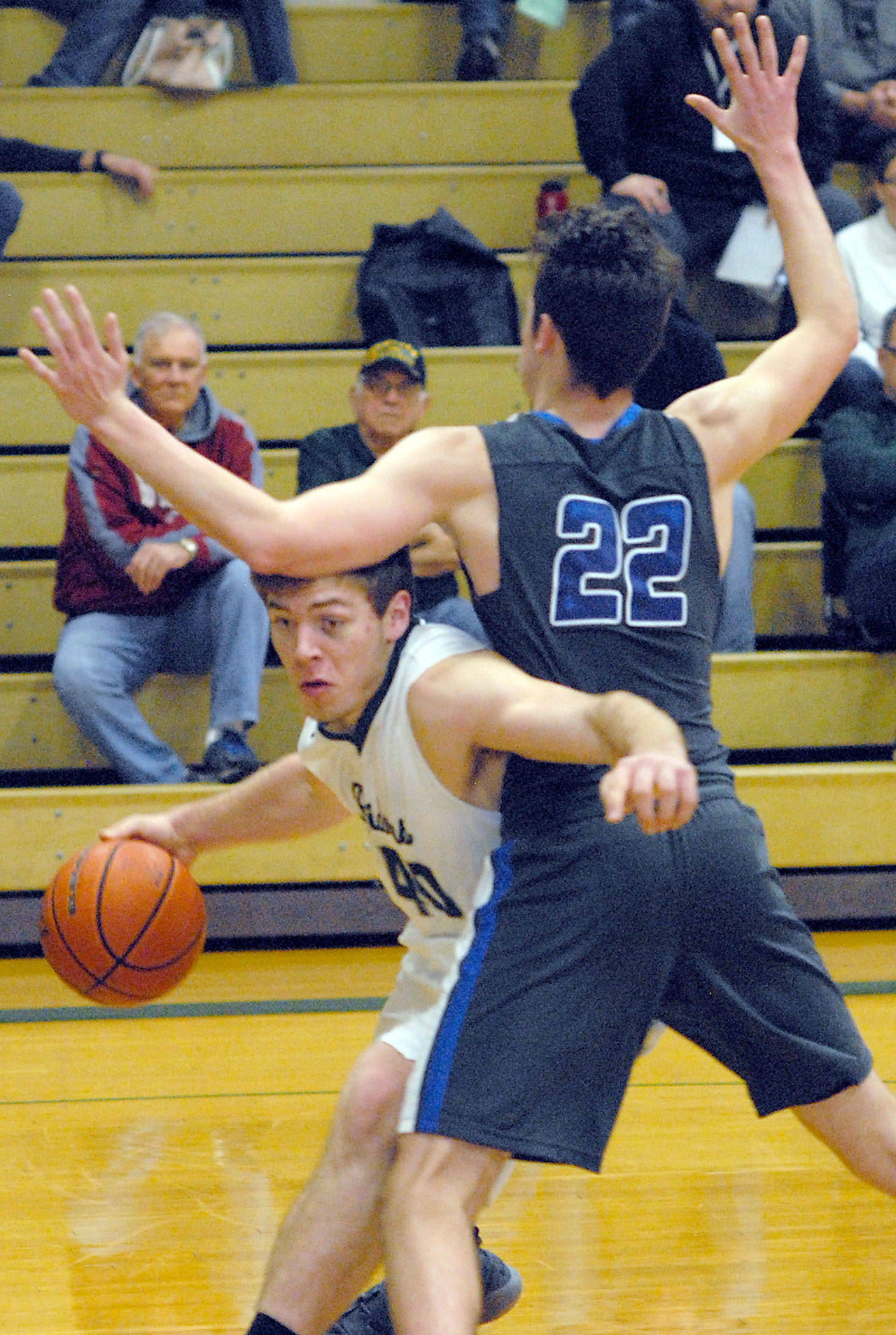 Port Angeles’ Anton Kathol, left, works his way around the defense of Olympic’s Keaton Dean during the Riders’ 50-39 win Friday.                                Keith Thorpe/Peninsula Daily News