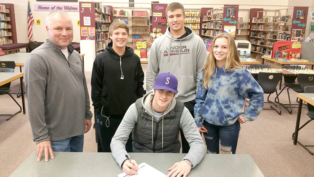 Sequim High School                                Sequim senior pitcher Ian Miller signs his letter of intent to play baseball at Yakima Valley Community College in Yakima. Joining Miller at the signing ceremony are, back row, from left: his father Kevin Miller, teammates Kyler Rollness and Johnnie Young and his sister Kori. Miller was a first-team All-Olympic League selection last season after posting a 5-1 record and 2.60 ERA.