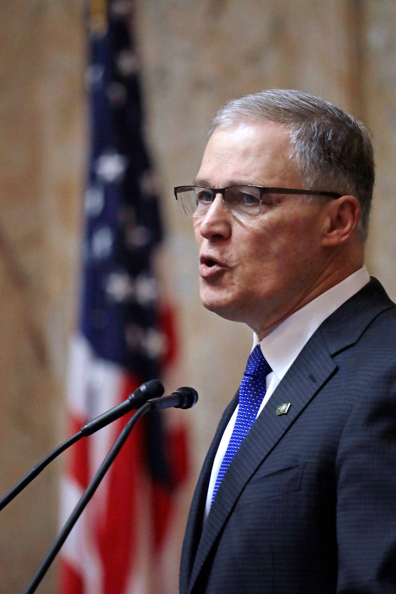 Gov. Jay Inslee speaks during his annual state of the state address before a joint legislative session Tuesday in Olympia. (Elaine Thompson/The Associated Press)