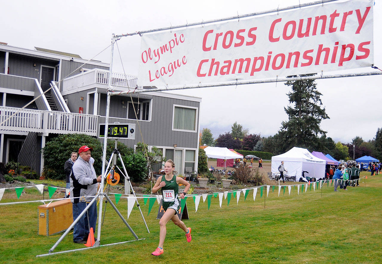 Michael Dashiell/Olympic Peninsula News Group Port Angeles freshman Lauren Larson races to a second-place finish at the Olympic League meet at The Cedars at Dungeness golf course in Sequim on Oct. 19, 2017. Larson has been selected as the All-Peninsula Cross Country MVP.