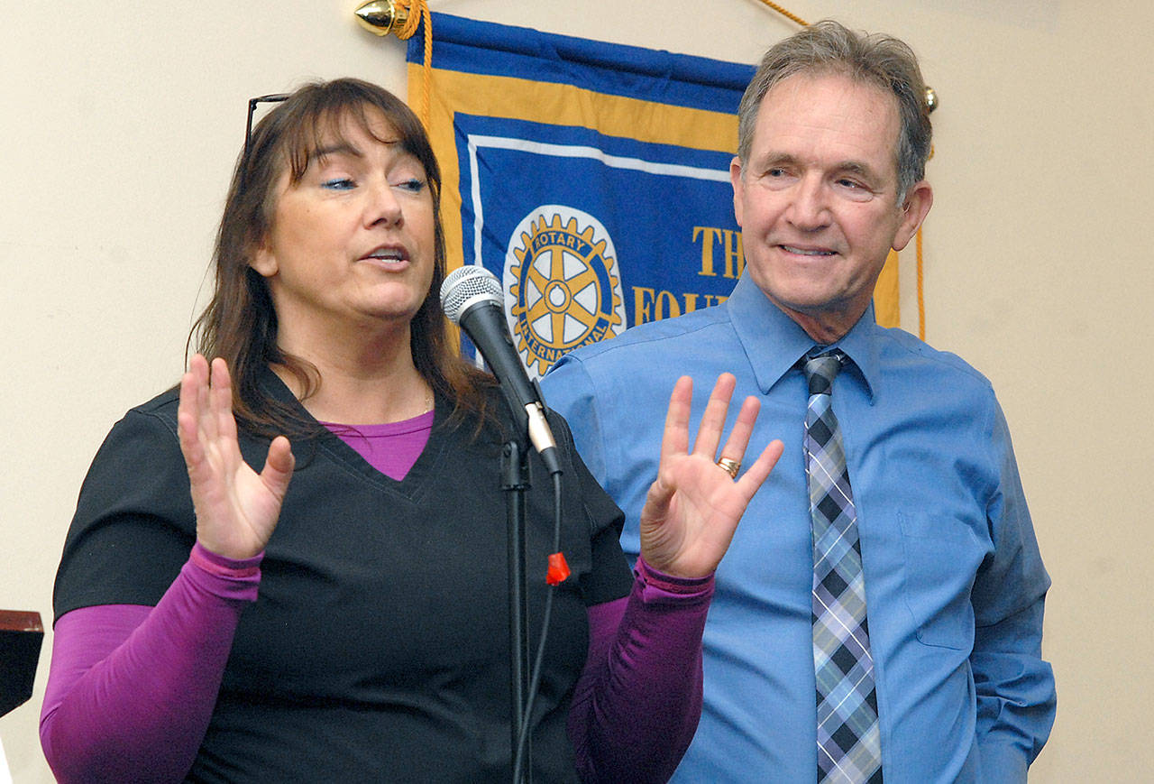 Marlene Bradow, nurse with the Port Angeles School District, left, speaks about the advantages of having an in-school health clinic as district Superintendent Marc Jackson listens during a presentation Wednesday to the Port Angeles Noon Rotary Club. (Keith Thorpe/Peninsula Daily News)