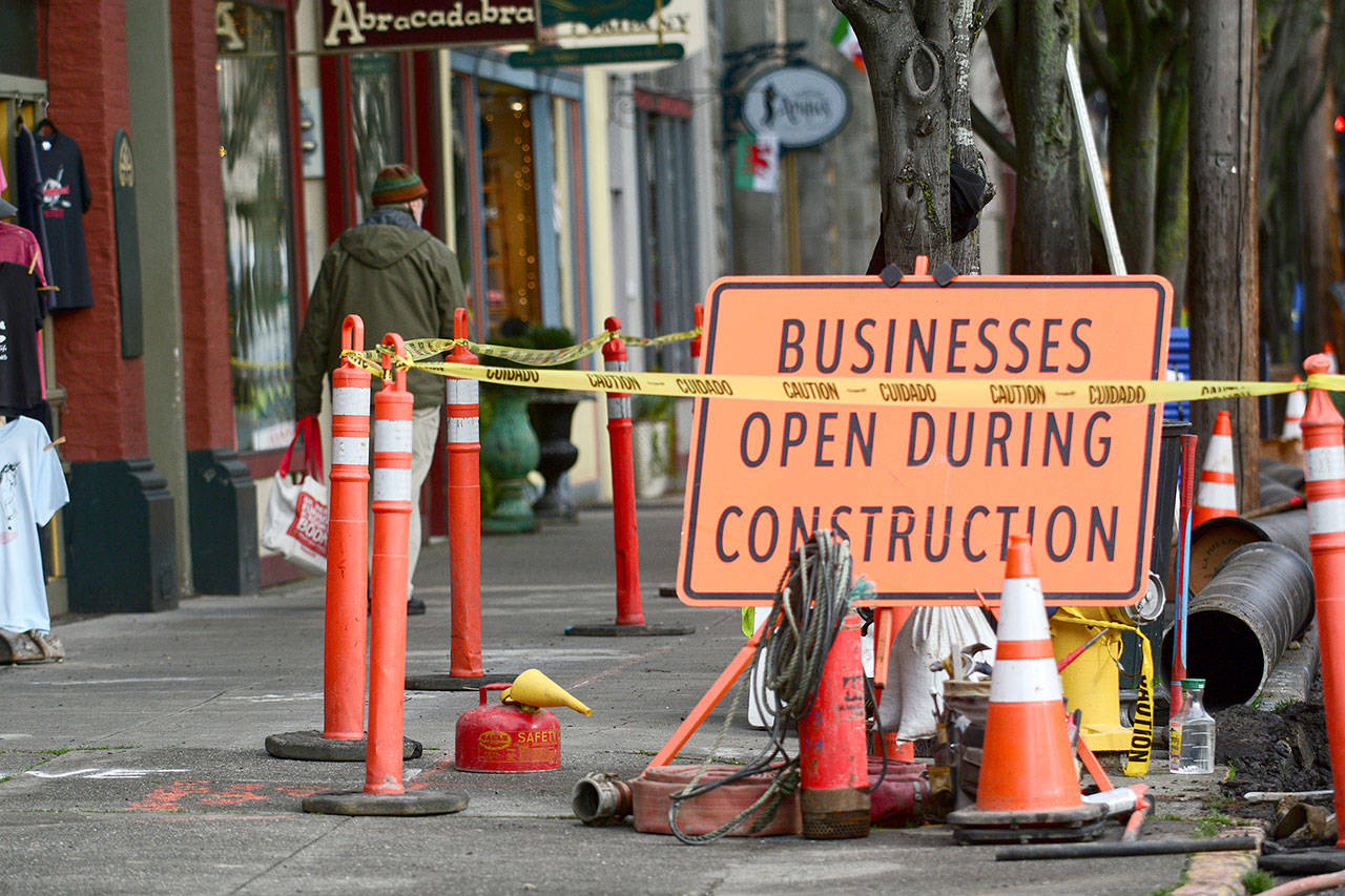 Port Townsend’s downtown sidewalks, typically bustling with shoppers, were unusually quiet Wednesday as construction on Water Street continued. (Jesse Major/Peninsula Daily News)