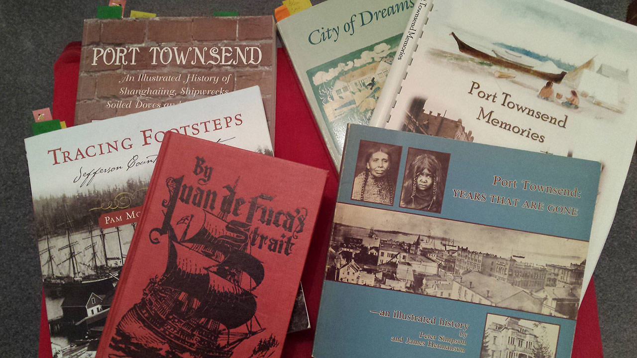 A collection of Port Townsend history books, including the work of May Smith, James McCurdy and Tom Camfield. (Linnea Patrick/for Peninsula Daily News)