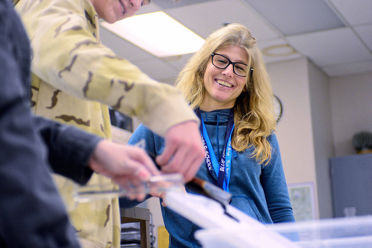 Blue Heron Middle School teacher Jennifer Manning watches as students conduct an experiment to learn about viscosity during her science class Wednesday. She is one of six staff members in Port Townsend who were recognized recently as National Board Certified Teachers. (Jesse Major/Peninsula Daily News)