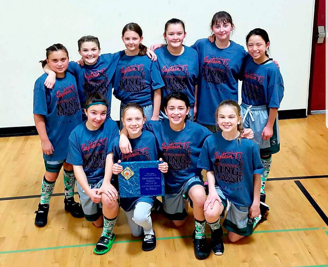 The 6th Grade Threat Port Angeles AAU basketball team went 4-0 last weekend at the Captain T’s Martin Luther King Tournament, defeating Bainbridge Roots 31-18 in the title game. The team is 9-3 on the season and opened league play this weekend in Poulsbo. Team members are, top row, from left, Makenna Larson, Keira Gedelman, Waverly Mead, Clarissa Sprague, Ella Hollis and Dylan Baermann. Front row, Lilly Scheid, Isabelle Felton, Ciara Cargo-Acosta and Vienna Shamp.