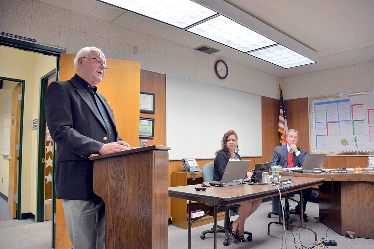Bill Kindler gives a report on the Port Angeles Education Foundation during the Jan. 4 school board meeting while Jennifer Wilson and Superintendent Marc Jackson listen on. (Patsene Dashiell/Port Angeles School District)