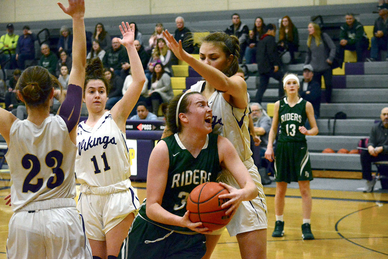 Port Angeles Jaida Wood (33) goes up for a layup against North Kitsaps Erin Pearson (20) during the Riders 54-48 win over the Vikings on Jan. 31.                                Mark Krulish/Kitsap News Group
