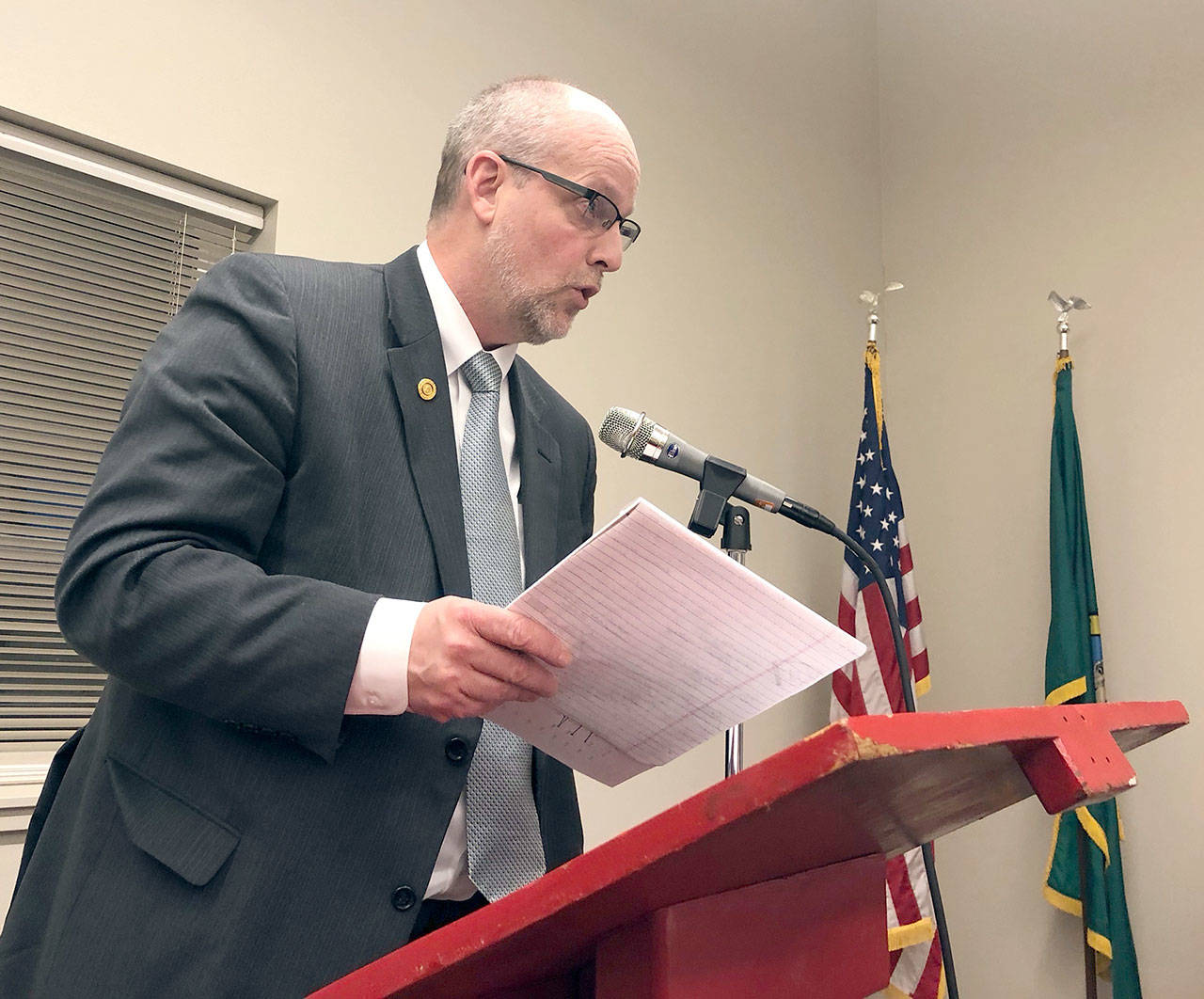 Chimacum School District Superintendent Rick Thompson addresses the Public Utility District commissioners regarding electric rate hikes for 2018 at a hearing Monday. (Jeannie McMacken/for Peninsula Daily News)