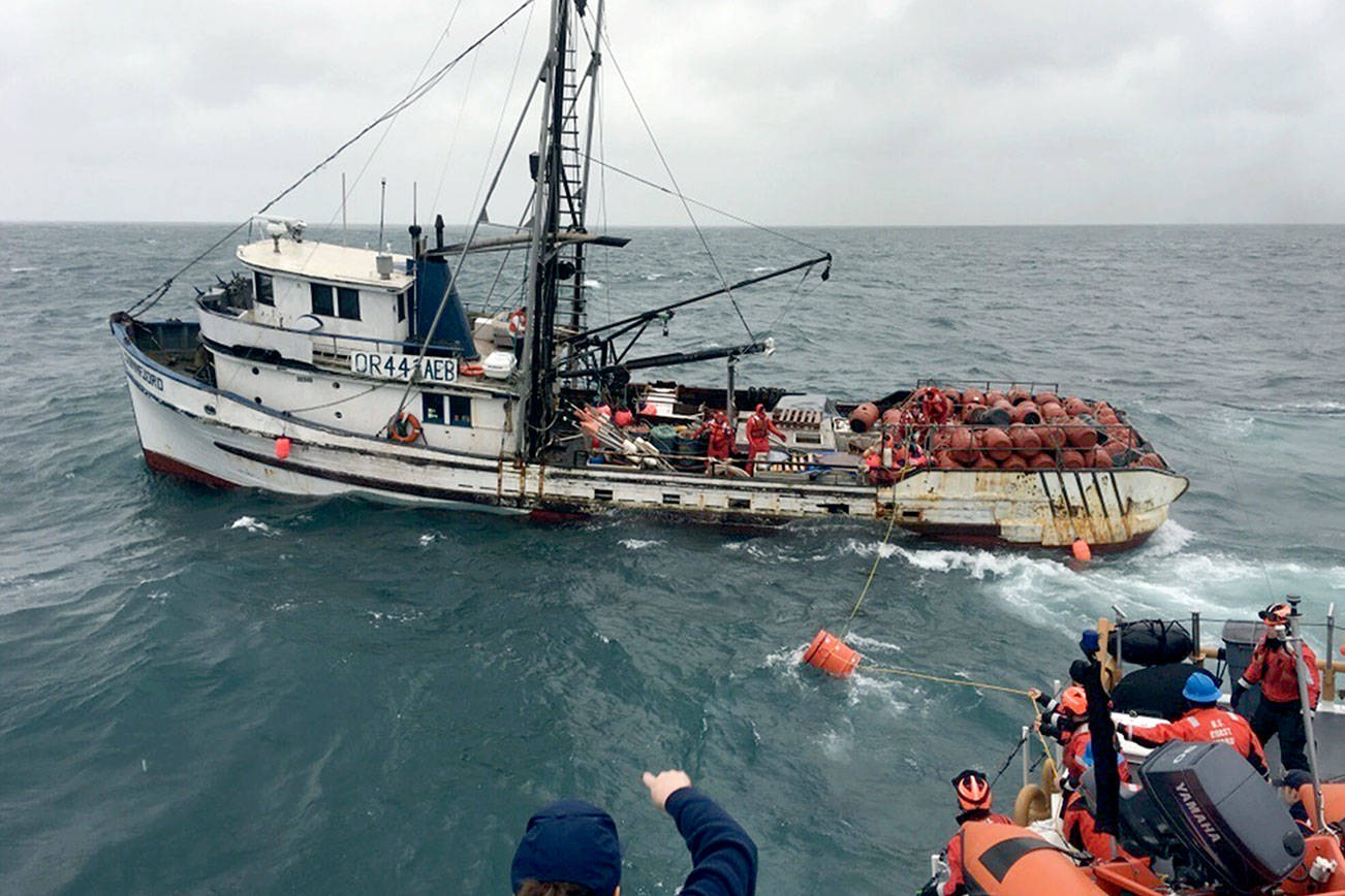 The crew of the Coast Guard Cutter Cuttyhunk pass two dewatering pumps to the crew of the fishing vessel Sunnfjord as their vessel took on water off Cape Alava, Wash., Jan. 31, 2018. Unable to start either pump or keep up with the rising water, the fishermen eventually abandoned ship. U.S. Coast Guard photo by Petty Officer 2nd Class Alexander Warriner.