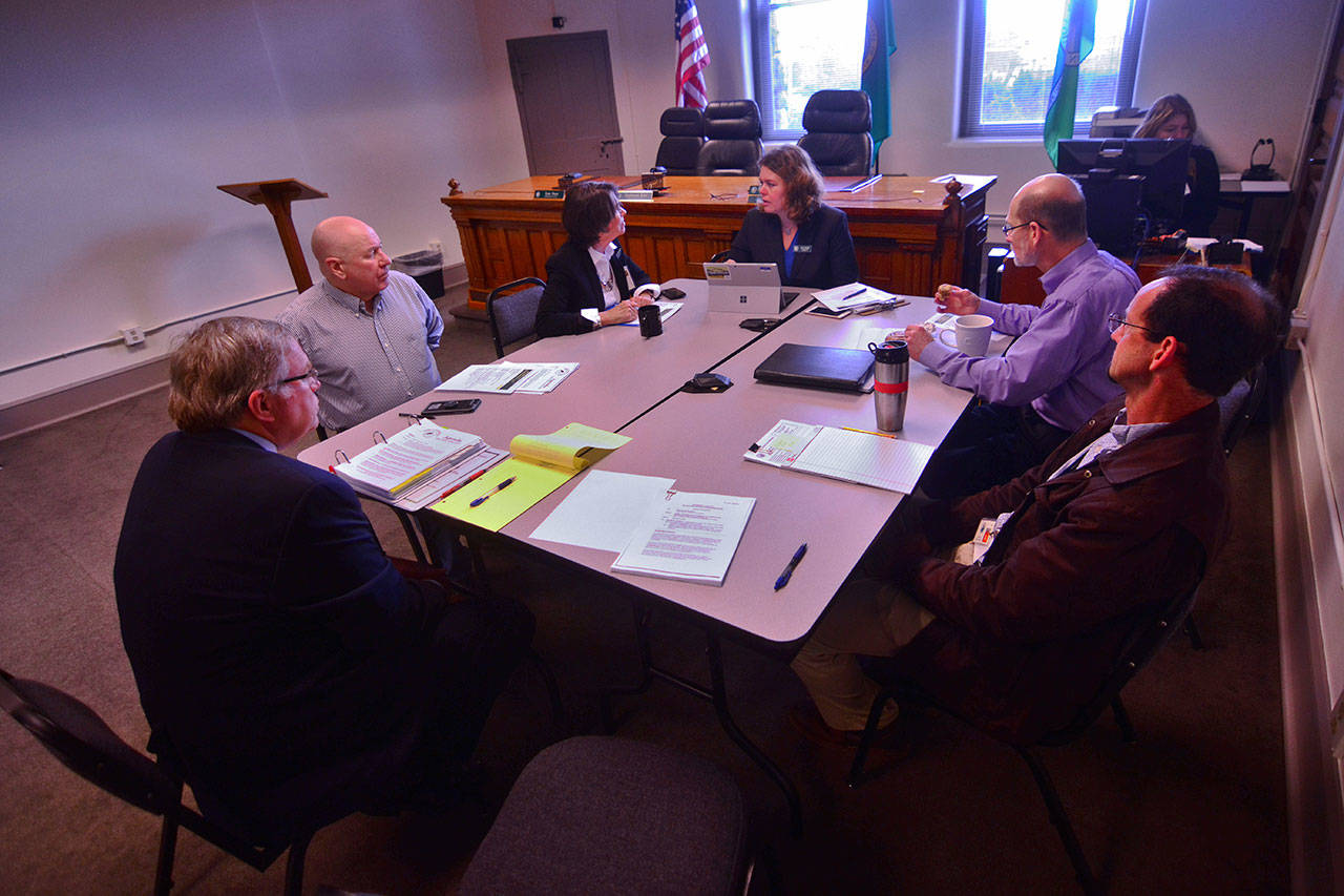 Jefferson County commissioners and county staff discuss a proposed change to the county’s public records policy during their meeting Monday afternoon. (Jesse Major/Peninsula Daily News)