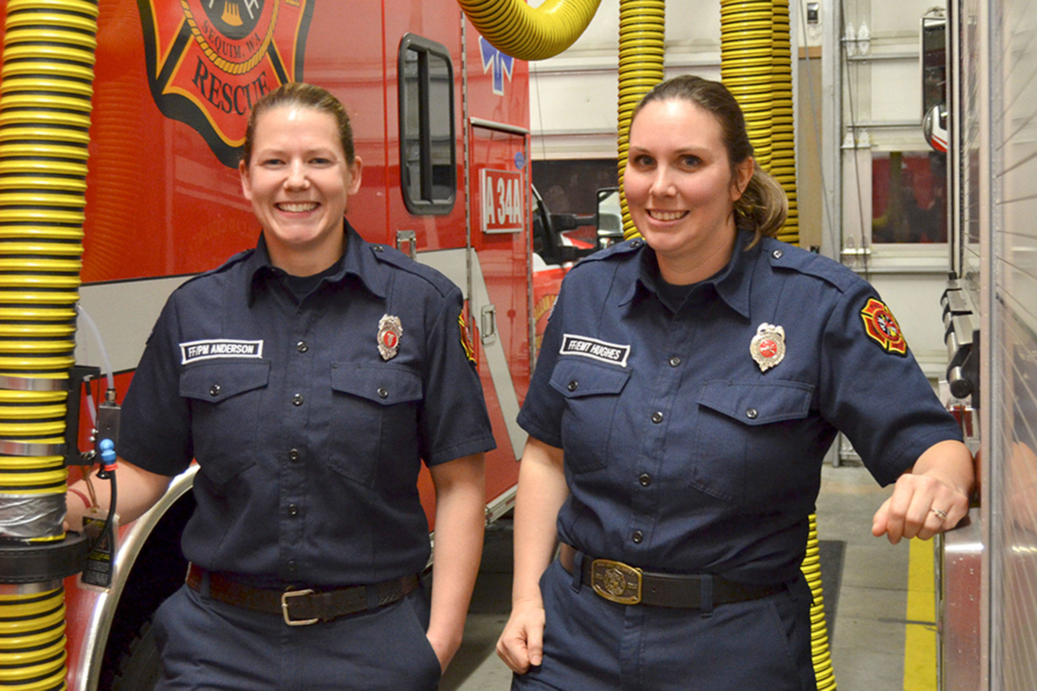 <strong>Matthew Nash</strong>/Olympic Peninsula News Group According to the National Fire Protection Association, in 2016 women make up about 7 percent of firefighters across the U.S. In Sequim Stefanie Anderson, left, is Clallam County Fire Districts
No. 3s only female career firefighter and Anaka Hughes is one of fewer than 10 female volunteer firefighters. In January, they were named Career and Volunteer Firefighters of 2017.