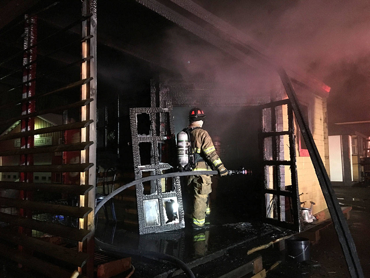 East Jefferson Fire-Rescue fights an early morning blaze in Port Townsend on Wednesday. (Bill Beezley/East Jefferson Fire-Rescue)