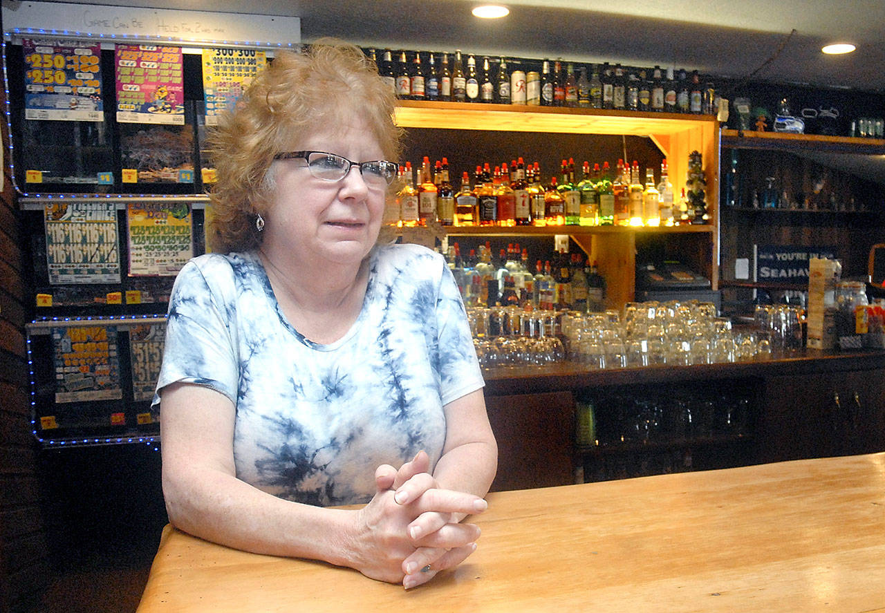 Elda Brandt, owner of The Dam Bar on U.S. Highway 101 west of Port Angeles, is facing legal penalties for allegedly allowing copyrighted songs to be sung on karaoke night without a music industry license. (Keith Thorpe/Peninsula Daily News)