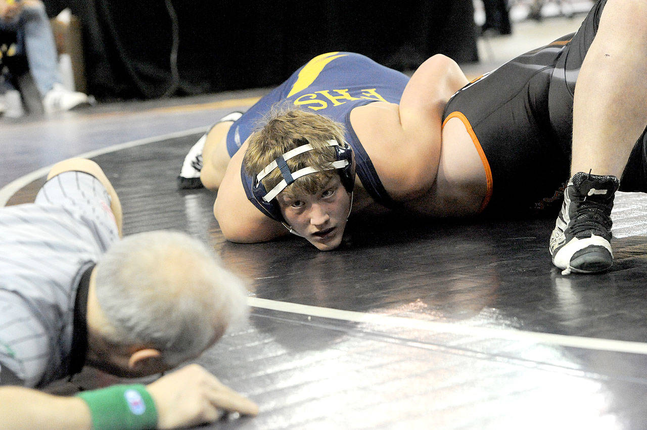 Forks’ Luke Dahlgren awaits the official’s signal for a pin as he pins Wyatt Tynan of Zillah at the Mat Classic on Saturday. Dahlgren went on to place fourth at state at 220 pounds. (Lonnie Archibald/for Peninsula Daily News)