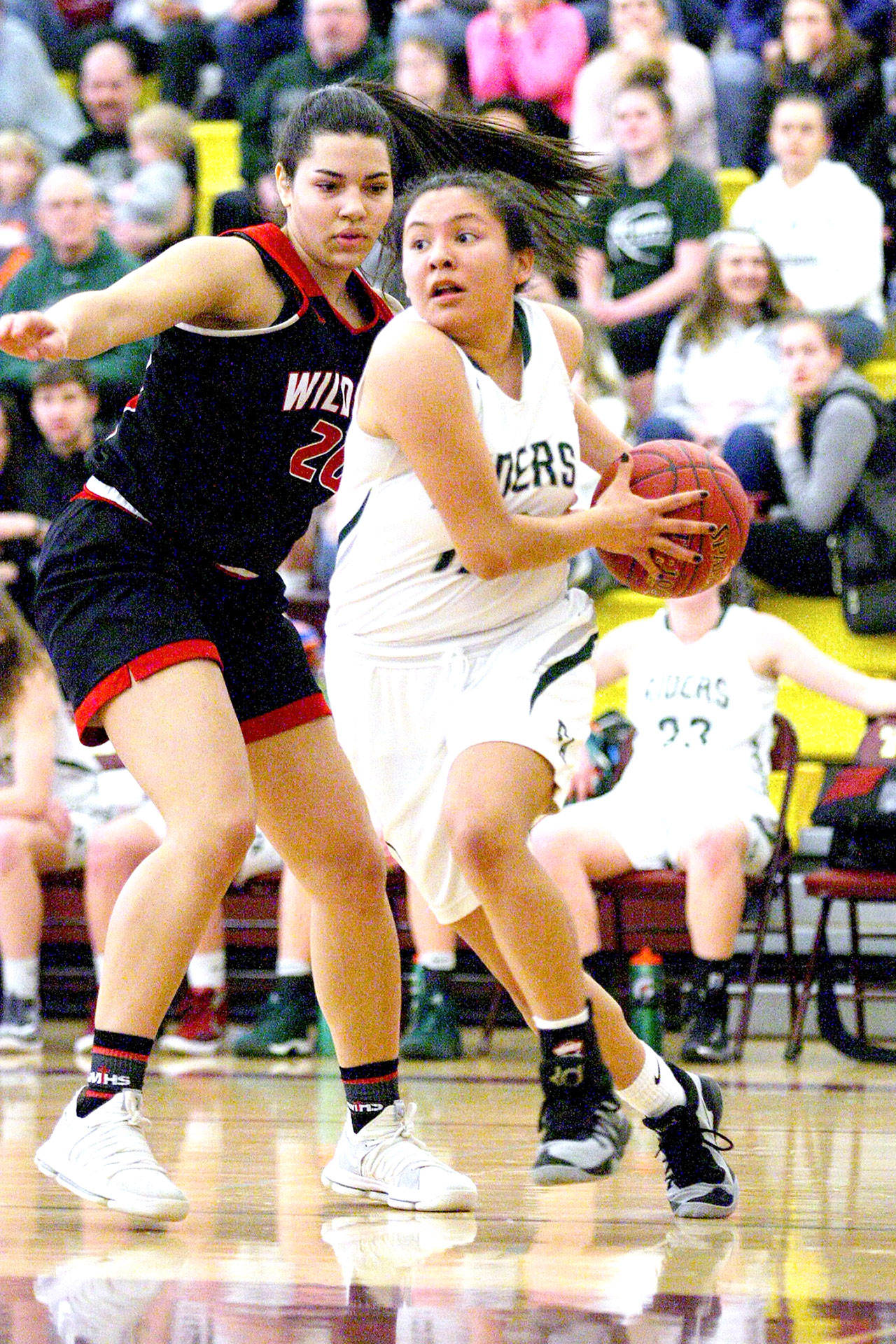 Port Angeles’ Cheyenne Wheeler looks to drive against Archbishop Thomas Murphy’s Julia Lucas in their 2A Regionals game Saturday at Mount Tahoma High School in Tacoma. ATM won 50-36, but the Riders will move to play at the 2A state tournament Wednesday. (David Willoughly/for Peninsula Daily News)