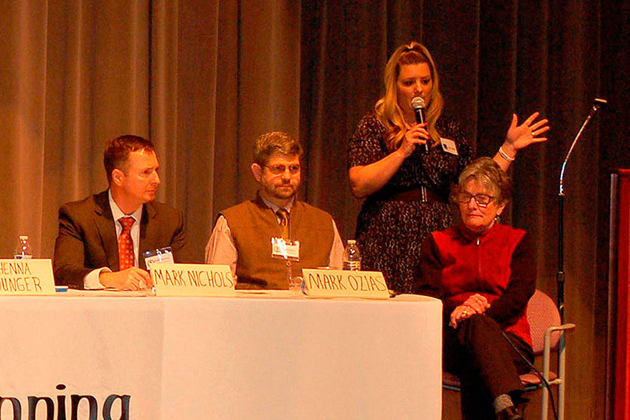 In the back left, Shenna Younger, co-founder of The Beginning, discusses the issue of sexual assault, abuse and misconduct at a forum Feb. 22 at the Sequim High School Auditorium with Clallam County Prosecuting Attorney Mark Nichols, front left, Clallam County Commissioner Mark Ozias and co-founder of The Beginning Bertha Cooper. (Erin Hawkins/Olympic Peninsula News Group)