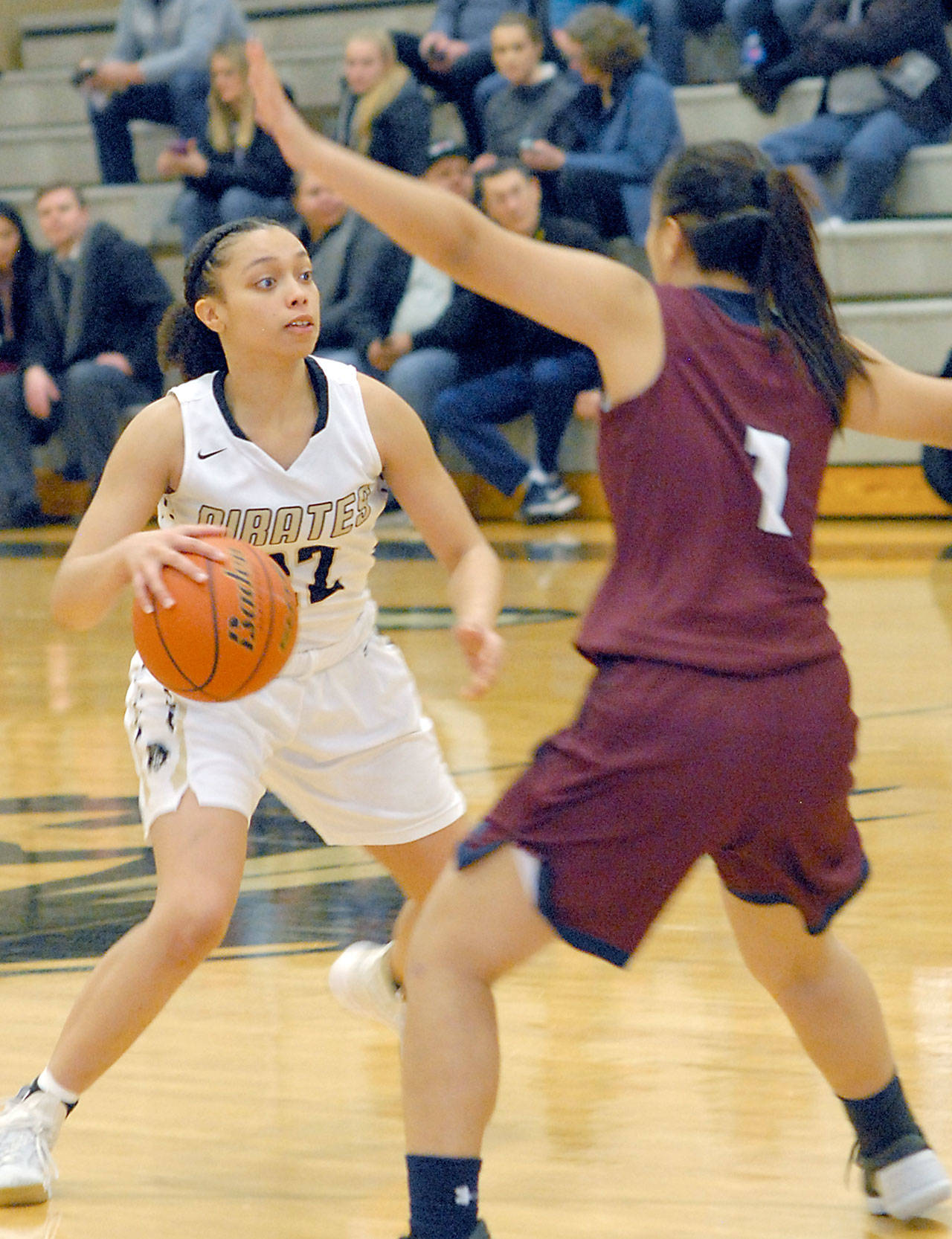 Keith Thorpe/Peninsula Daily News Peninsula’s Tiffani Smith, left, looks for a way around Whatcom’s Phoebe Wong in the closing minutes of Friday night’s matchup in Port Angeles.