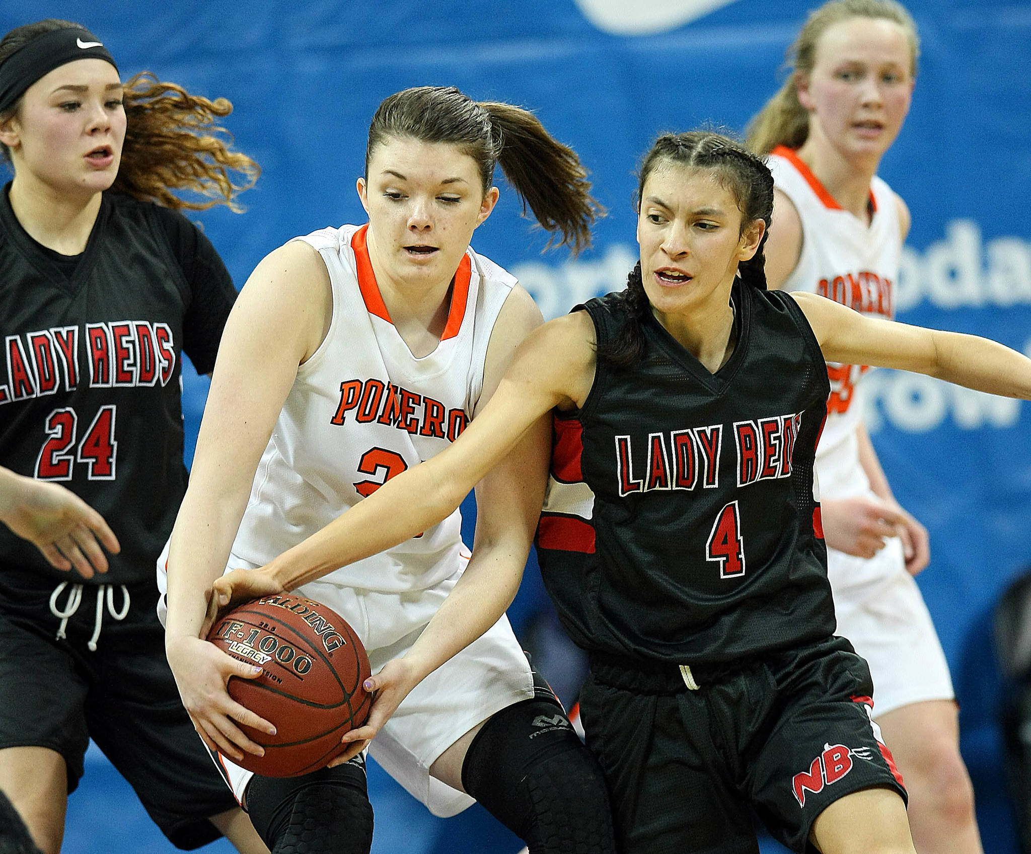 David Willoughby/for Peninsula Daily News                                Neah Bay’s Lalia Greene (4), tries to steal the ball from Pomeroy’s Sydney Smith during the Red Devils’ 44-29 Class 1B state semifinal loss Friday at Spokane Arena.