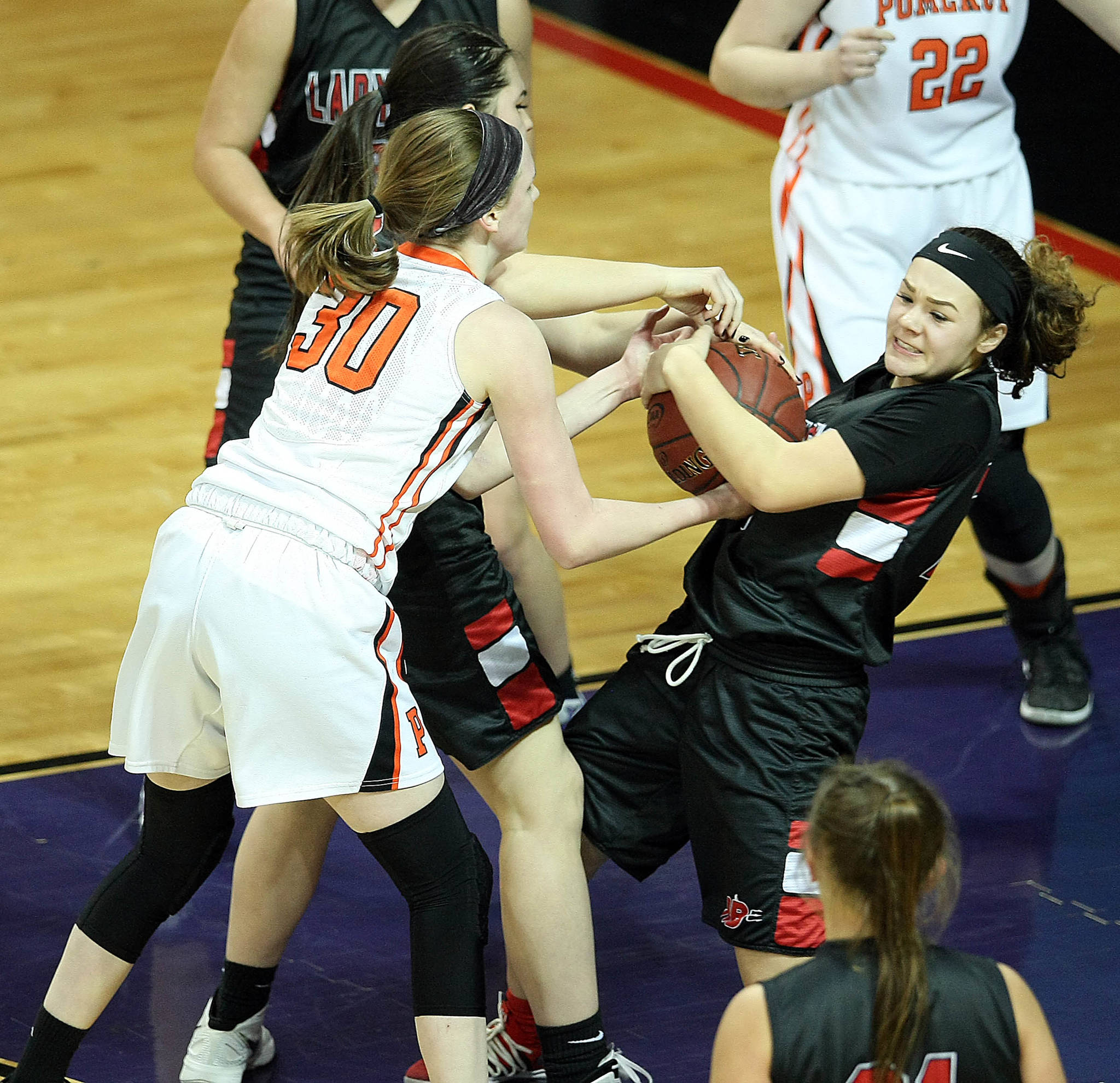 David Willoughby/for Peninsula Daily News                                Neah Bay’s Patience Swan, right, scraps for possession of the ball during with Pomeroy’s Maddy Dixon during the Red Devils’ 44-29 Class 1B state semifinal loss Friday at Spokane Arena.
