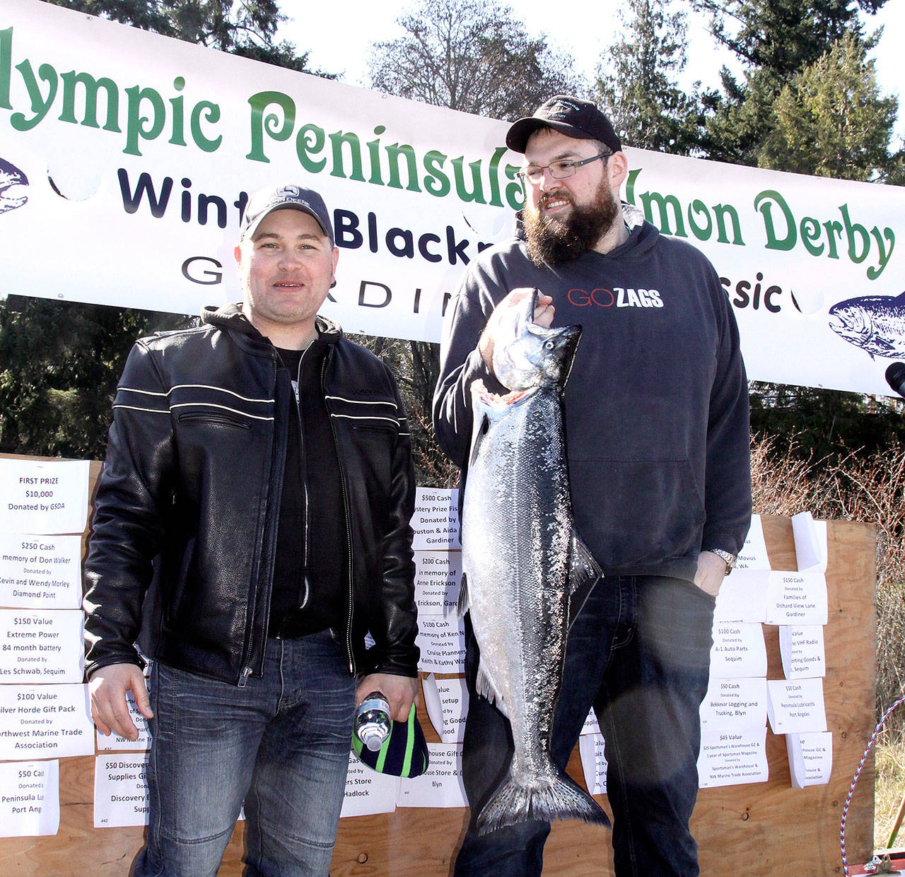 When is a tie not a tie? That is what happened with the results of the annual Olympic Peninsula Salmon Derby thatconcluded on Sunday afternoon with the awards given out at the Gardiner Boat launch. Micah Hanley of Mount Vernon,left, caught a 16.85-pound salmon at 11:23 a.m. on Saturday to lead the derby. Not to be outdone Kyle Madison of PortAngeles caught a salmon also at 16.85 pounds on at 9:35 a.m. Sunday. Since both fish were tied in weight the derbyrules state that the first of the two fish caught ise ahead in the standings. The difference is $10,000 first prize and$2,000 second prize. Hanley takes first and Madison gets second. Third place was a 16.40-pound salmon from LarryPhillips of Olympia. The three-day derby had 857 paid fisherman with a total of 233 fish caught and registered. Theaverage weight was calculated at 8.15 pounds. This was Hanley’s first derby on the Peninsula. He told his family that hewould only go fishing on Saturday, but was persuaded to come back Sunday for a prize since it looked like his fish wouldhold up in the lead, which technically, it did.