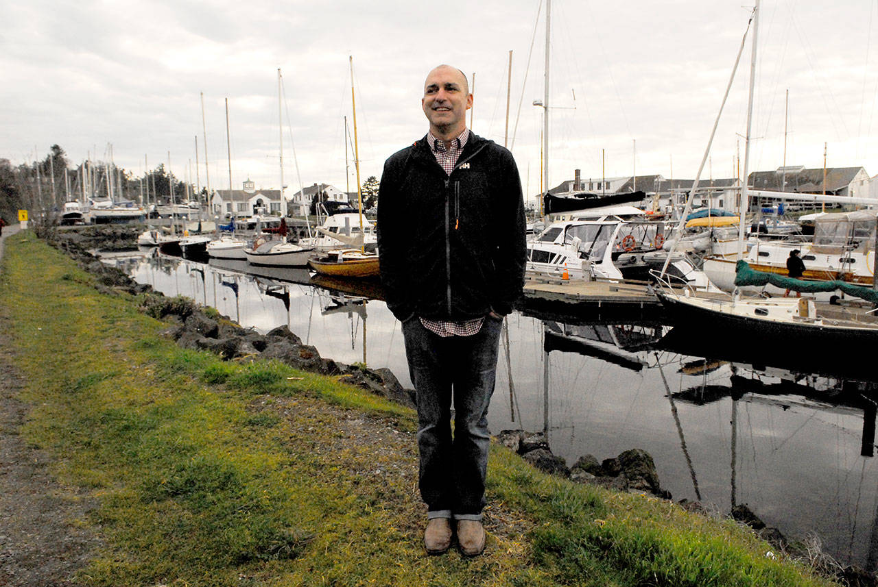 Northwest Maritime Center Executive Director Jake Beattie stands at the Point Hudson campus that his nonprofit wants to manage. A plan was submitted to the Port of Port Townsend in January that proposes a 50-year master lease, payments, investments and revenue sharing. (Jeannie McMacken/Peninsula Daily News)