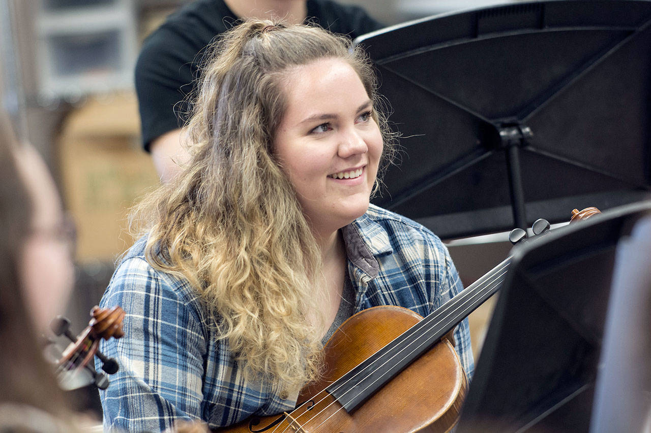 Port Angles High School senior Lauren Waldron laughs after cracking a joke in her Chamber Orchestra class Monday. She recently learned she had earned the National Federation of Music Clubs’ Wendell Irish Viola Award. (Jesse Major/Peninsula Daily News)