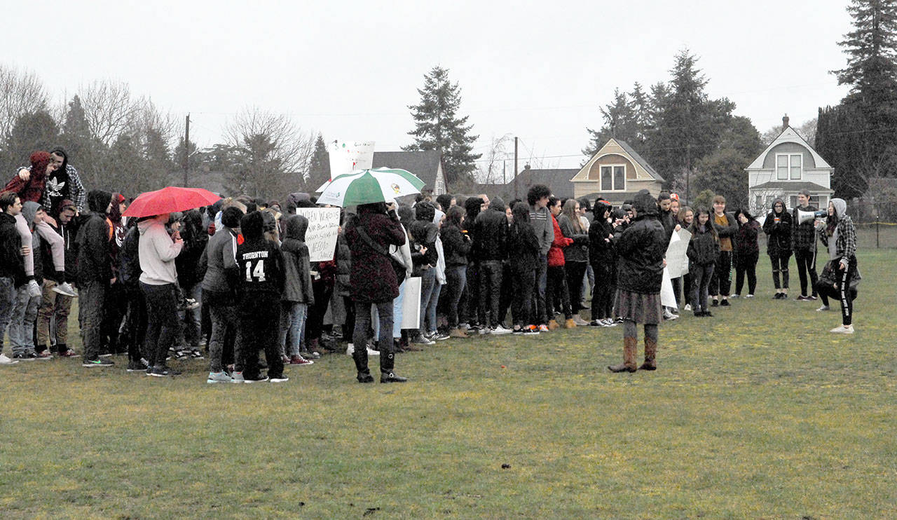 More than 300 members of the Port Townsend High School student body stood in the rain to participate in Wednesday’s demonstration to denounce gun violence on school campus. (Jeannie McMacken/Peninsula Daily News)