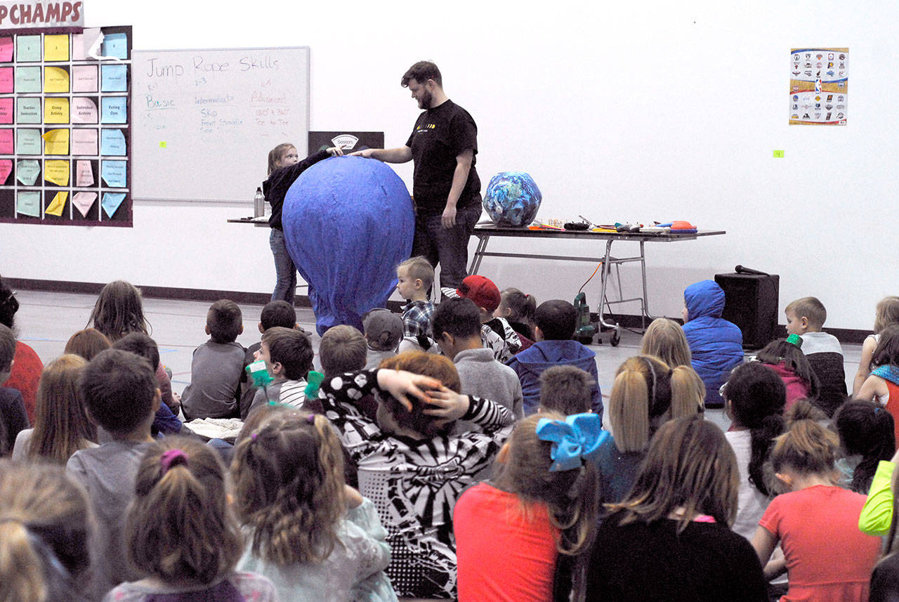 Chimacum Creek Primary students learned about flight during the “Flying Gizmos” assembly. A demonstration showed how Joseph and Etienne Mongolfier’s balloon experiment worked, and that a sheep, a duck and a rooster were successfully launched and returned safely to earth. The Boeing Bluebills of Port Ludlow sponsored the Museum of Flight educators who also brought a pop-up planetarium. (Jeannie McMacken/Peninsula Daily News)