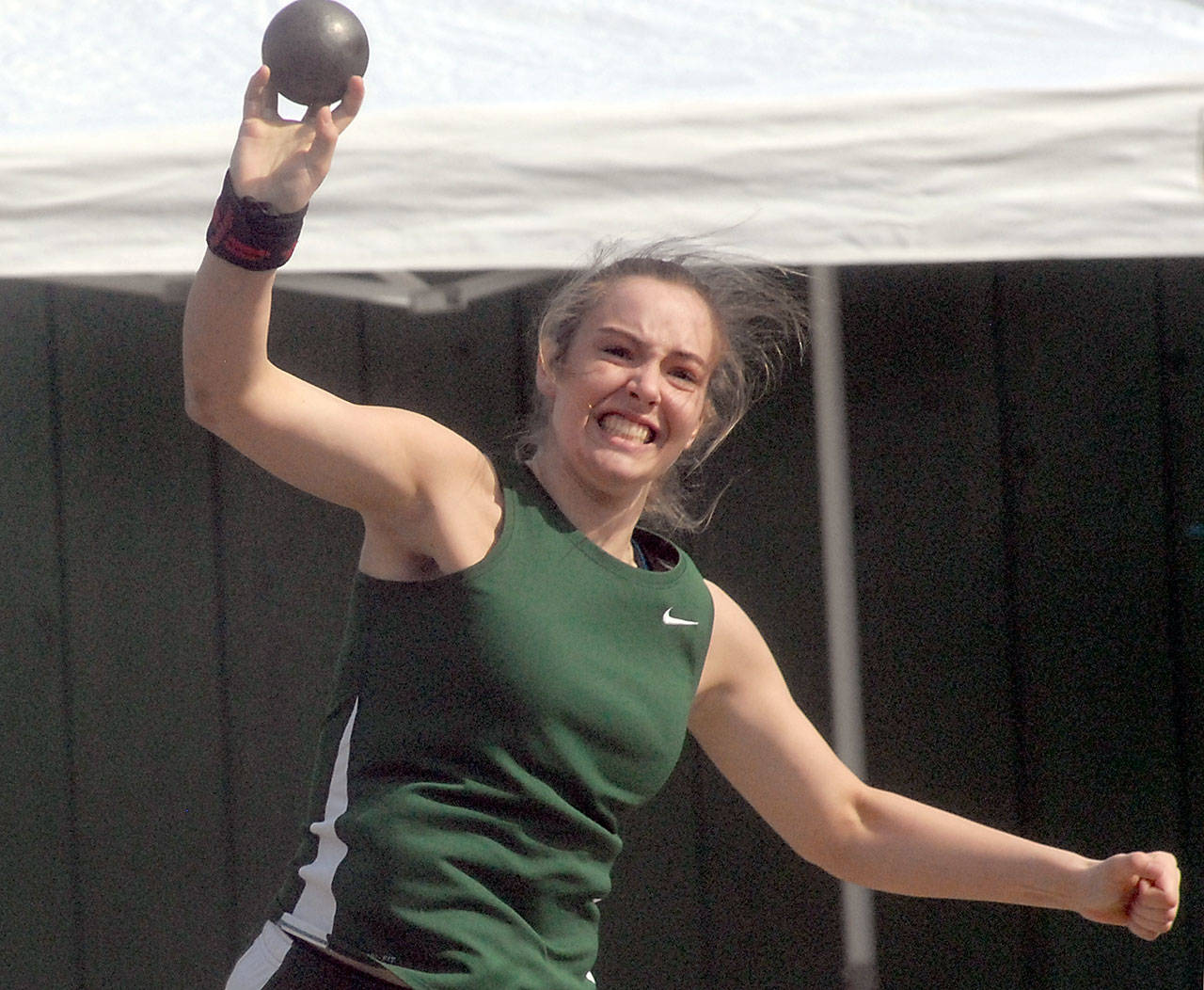 Devin Edwards of Port Angeles puts in the girls shot put on her home field during the Port Angeles Invitational meet on Saturday. (Keith Thorpe/Peninsula Daily News)