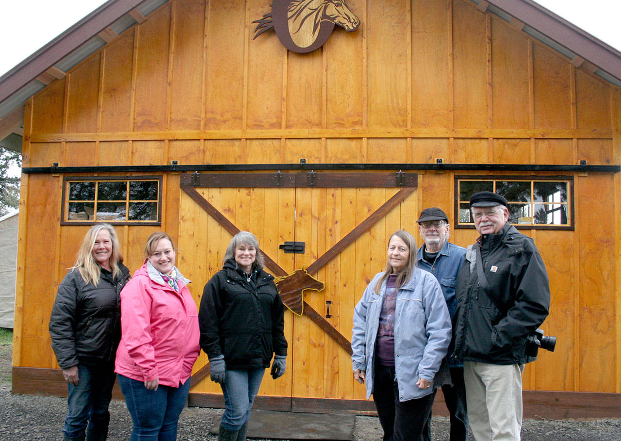 Thanks to major fundraising efforts and its many supporters. the Olympic Peninsula Equine Network finally has a barn and tack store. Shown are, from left, OPEN Vice-President Diane Royall; Valerie Taylor, equine program director for the Global Federation of Animal Sanctuaries; OPEN President Valerie Jackson; and OPEN directors Glenda Cable, Allan Bryd and Mike Vaillancourt. (Karen Griffiths/for Peninsula Daily News)