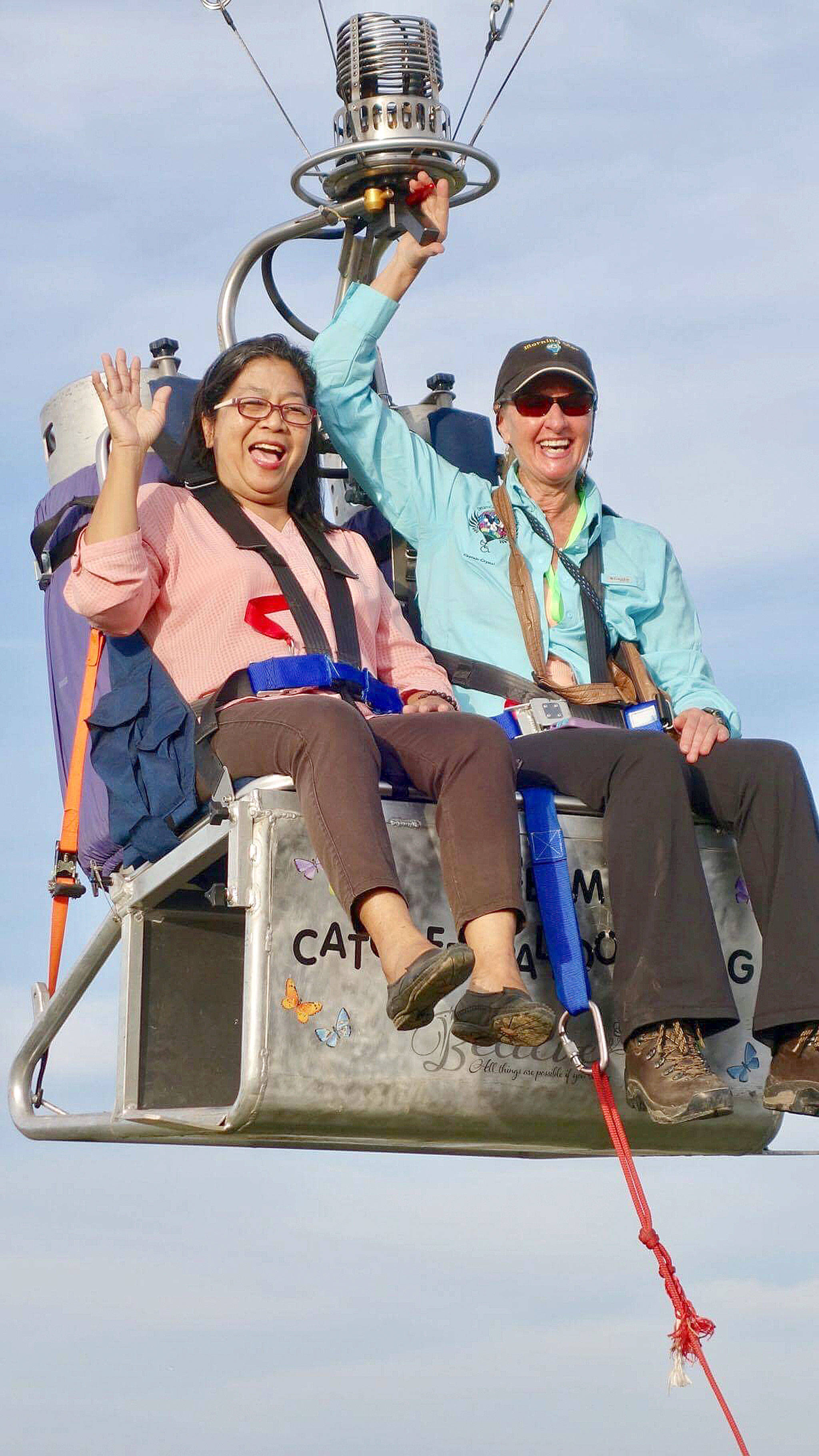 Captain-Crystal Stout, right, flying with a visitor at the Lubao International Balloon and Music Festival in 2017, returns to the festival this week to fly March 22-25. She brings Sequim’s nonprofit hot air balloon Dream Catcher to offer balloon rides to senior citizens and World War II veterans in the Philippines. (Capt. Crystal Stout)