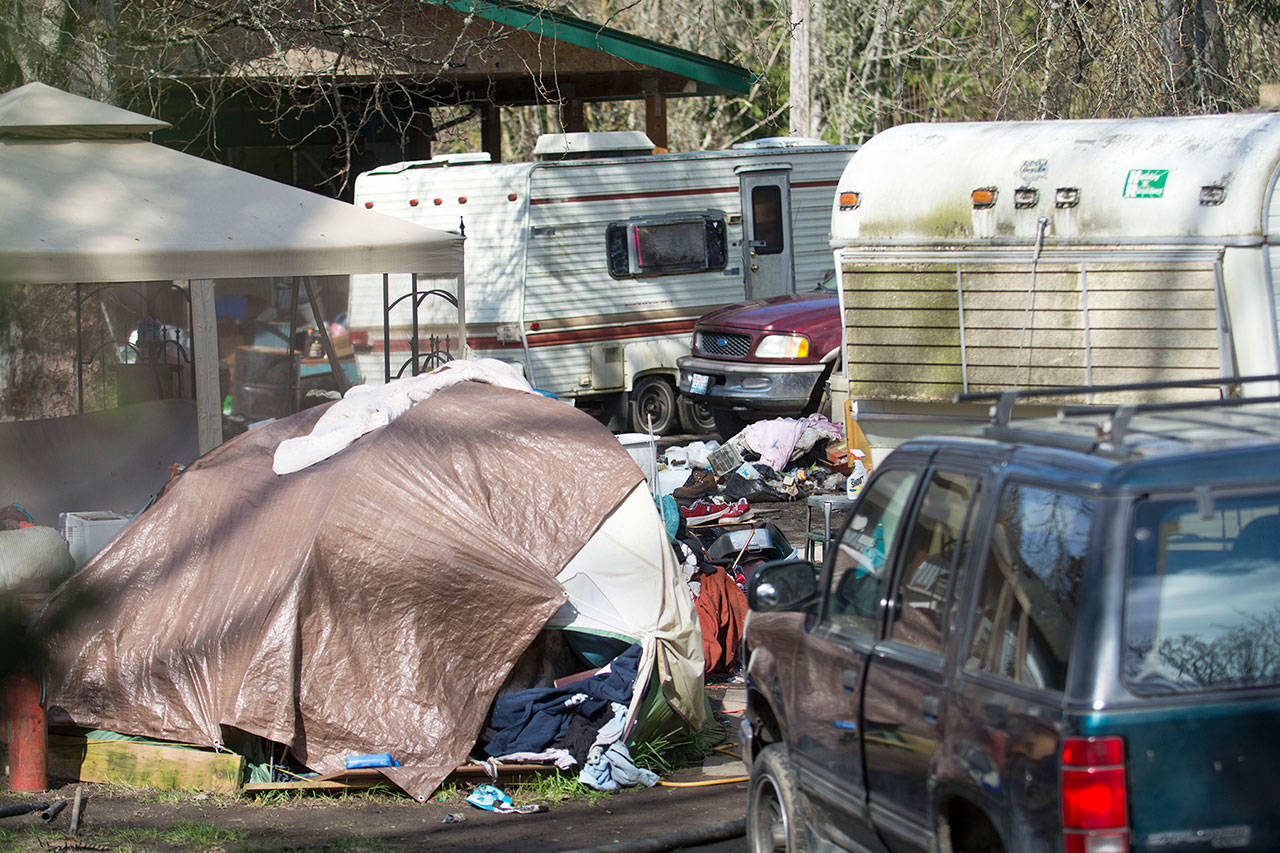 Clallam County is seeking a warrant of abatement for the property at 313 McDonnell Creek Road, which is covered in garbage, junk vehicles and doesn’t properly manage sewage, according to a lawsuit. (Jesse Major/Peninsula Daily News)