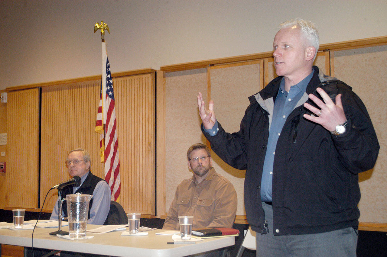 State Sen. Kevin Van De Wege speaks at a town hall in Forks on Thursday as state Reps. Steve Tharinger, left, and Mike Chapman look on. (Rob Ollikainen/Peninsula Daily News)