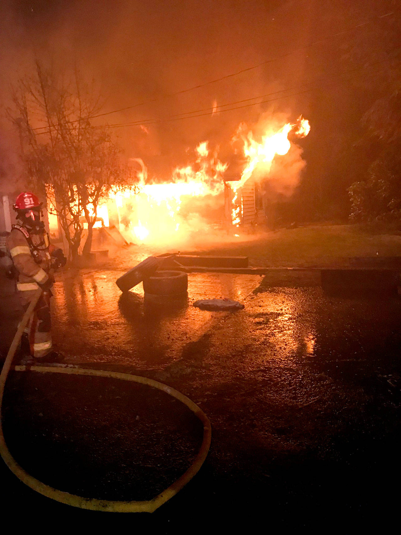 Firefighters battle a blaze at a home outside of Forks early Friday morning. (District 1 Chief Bill Paul)
