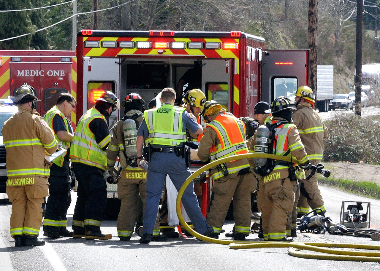 First responders help a victim following a collision on state Highway 19. (Patricia Willestoft/East Jefferson Fire Rescue)