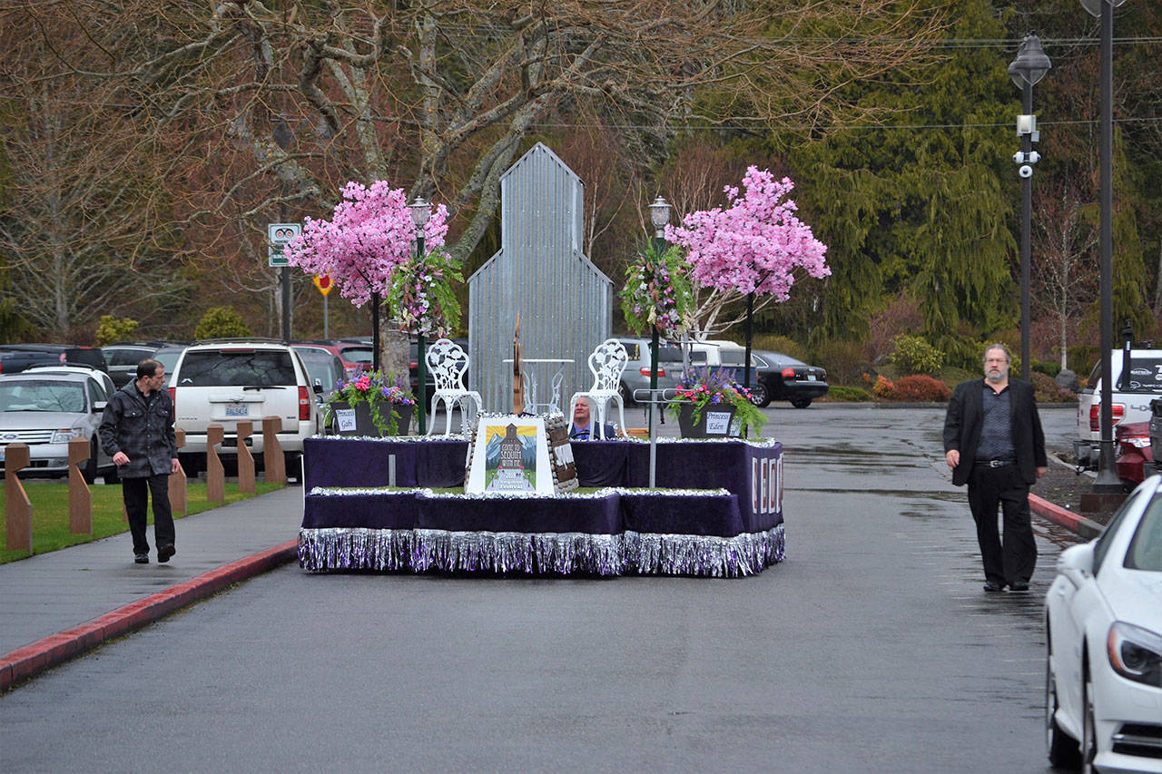 This year’s Sequim Irrigation Festival’s royalty float features scale versions of the local grain elevator and Sequim welcome sign along with blossoming cherry trees with 8,000 individually made flowers for each tree. It will first drive in the Daffodil Parade on April 7 followed by the Sequim Irrigation Festival’s Grand Parade on May 12. (Matthew Nash/Olympic Peninsula News Group)