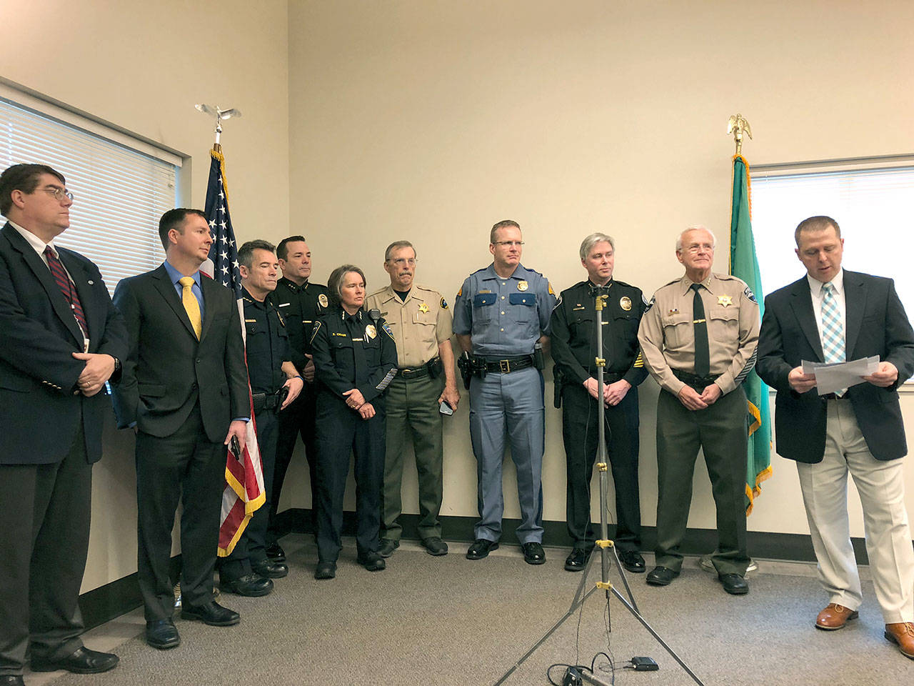 More than 60 law enforcement officials worked together to run an operation in Jefferson County targeting sexual predators. Representatives of the agencies held a press conference Tuesday morning to detail their collaboration, which led to 10 arrests. From left are Jefferson County Prosecutor Michael Haas, Clallam County Prosecutor Mark Nichols, Port Angeles Police Chief Brian Smith, Poulsbo Police Chief Dan Schoonmaker, Sequim Police Chief Sheri Crain, Clallam County Sheriff Bill Benedict, State Patrol Capt. Chris Old, Port Townsend Police Chief Michael Evans, State Patrol Lt. James Mjor and Jefferson County Sheriff David Stanko. (Jeannie McMacken/Peninsula Daily News)