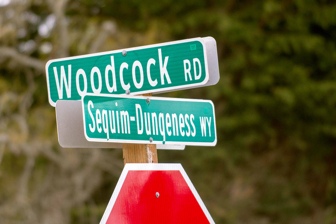 Clallam County officials are considering adding a traffic circle at the intersection of Woodcock Road and Sequim-Dungeness Way. (Jesse Major/Peninsula Daily News)
