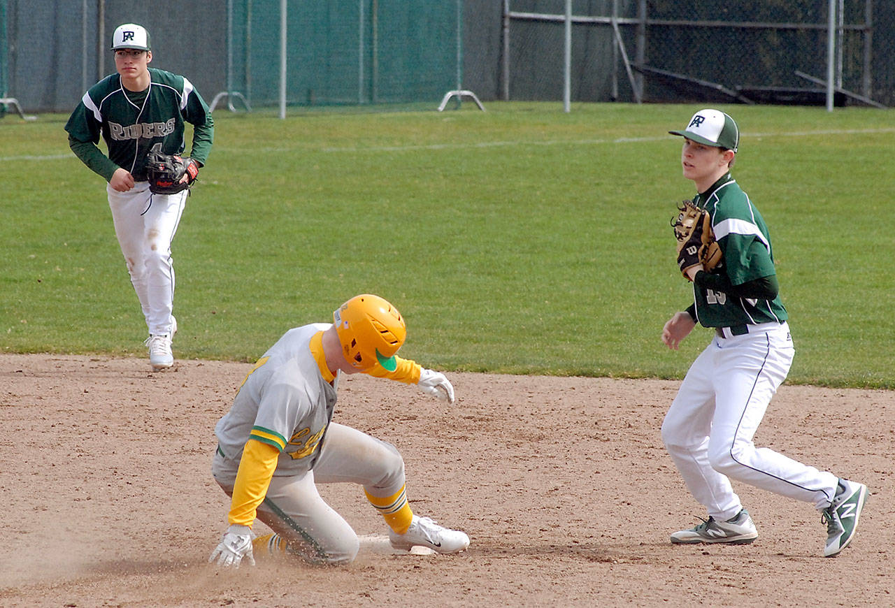 Keith Thorpe/Peninsula Daily News                                Lynden’s Jack Doolittle arrives late at second after being forced out by Port Angeles second baseman Milo Whitman, right, as shortstop Gavin Guerrero looks on in the fifth inning on Saturday at Port Angeles Civic Field.