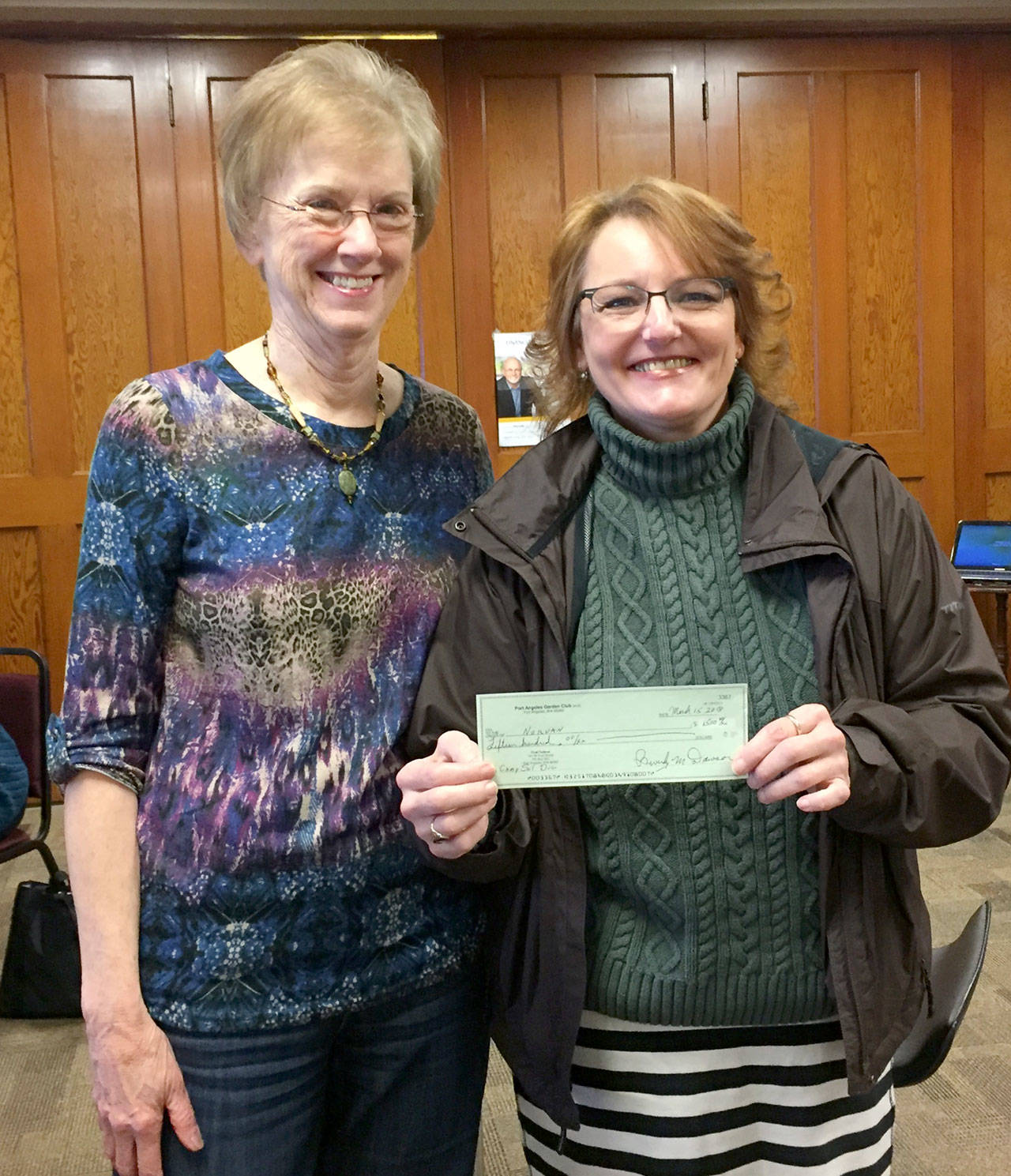 Port Angeles Garden Club From left, Port Angeles Garden Club Community Donation Committee chair, Karen Coles, presents a donation of $1,500 to Cheri Tinker, Sarge’s Place President and executive director.