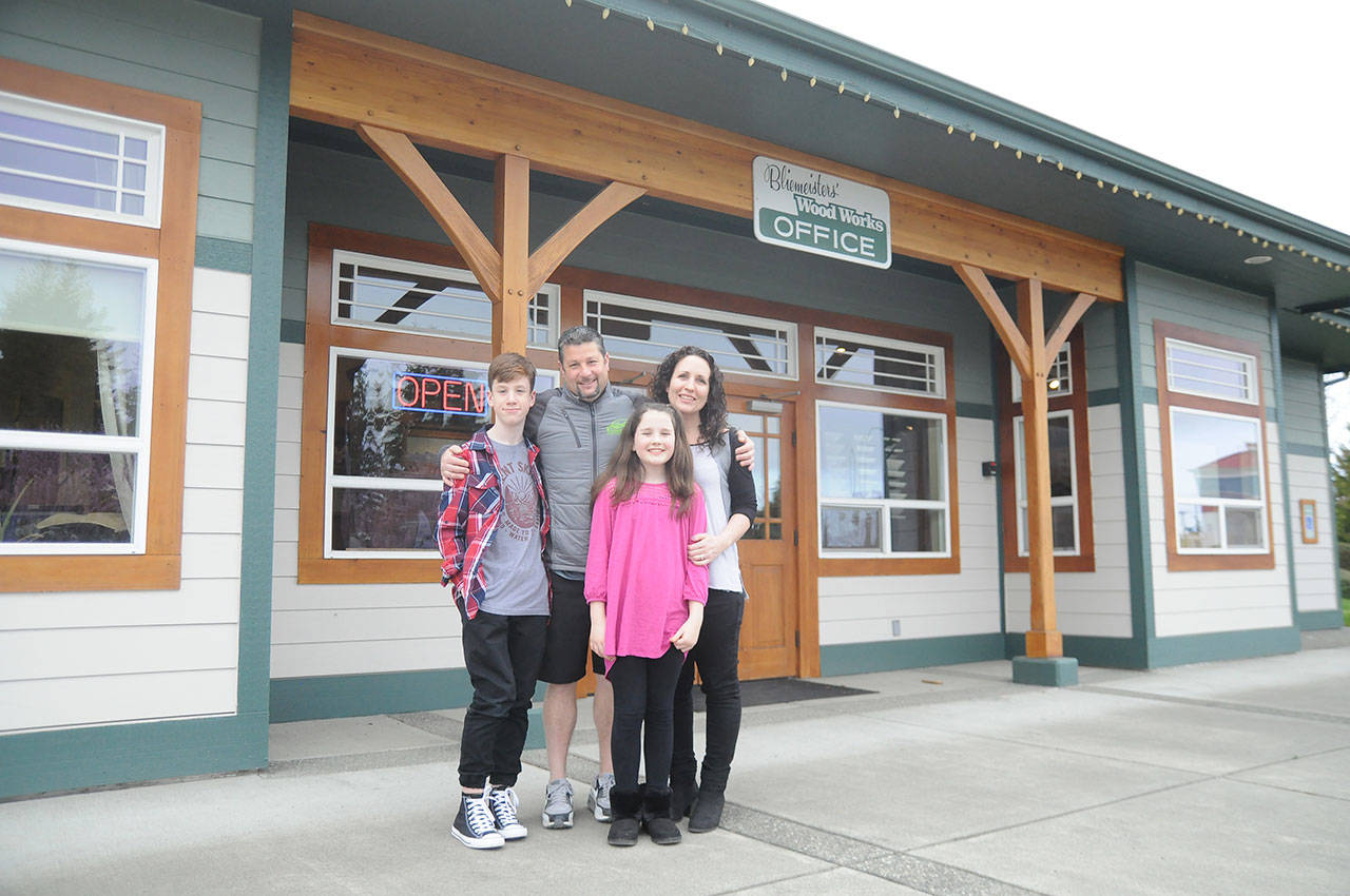 Jason Doig, his wife, Jeni, and children Ethan, 10, and Rylie, 10, outside Doig’s business, Bliemeisters’ Wood Works in Carlsborg. (Michael Dashiell/Olympic Peninsula News Group)