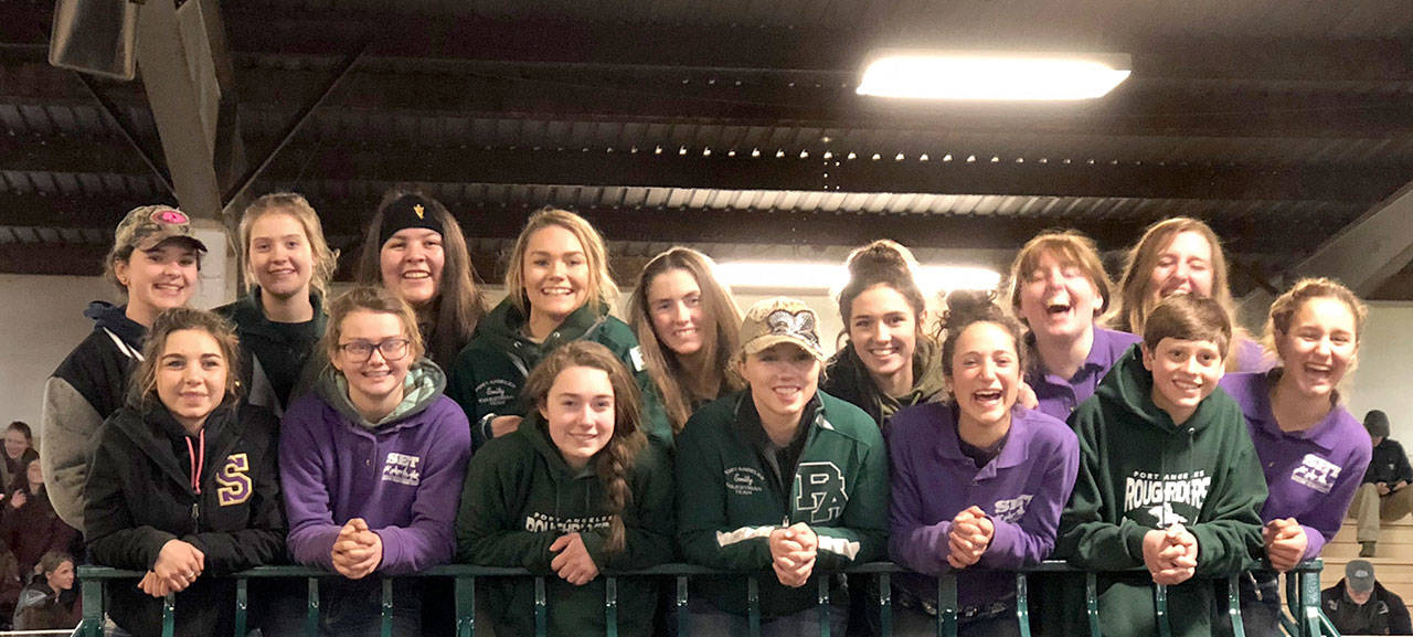Sequim and Port Angeles’ equestrian teams in the front row, from left, are Miranda Williams, Keri Tucker, Madison Carlson, Emily Menshew, Yana Hoesel, Ben Robertson and Grace Niemeyer; in the back row, from left, are Abbi Priest, Abigail Hjelmeseth, Lilly Thomas, Emily Gear, Cassi Ann Moore, Emma Albright, Madi Murphy and Amanda Murphy. (Bettina Hoesel)